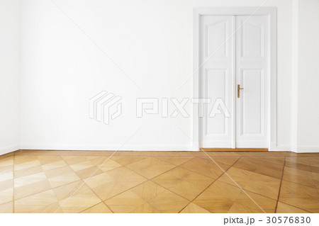 white wall door renovated room  parquet floor 30576830