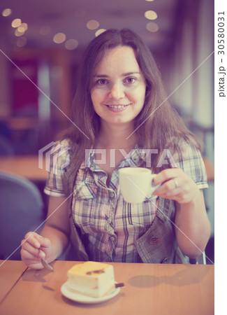 Adult girl drinking morning coffee 30580031