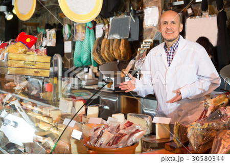 salesman selling cheese and jamon salesman selling cheese and jamon 30580344