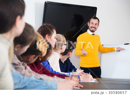 Students listening to teacher 30580657