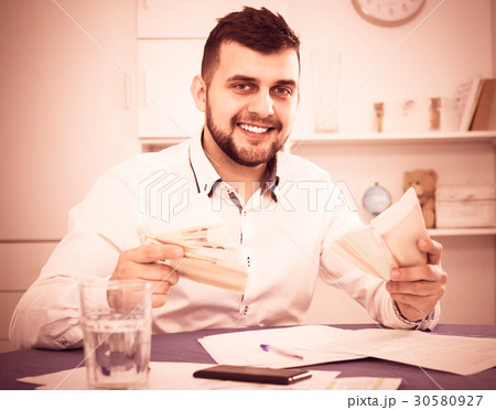 Male worker earning money effectively online Male worker earning money effectively online 30580927