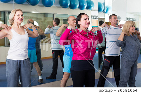 Group of adults doing aerobics exercise in sport club Group of adults doing aerobics exercise in sport club 30581064