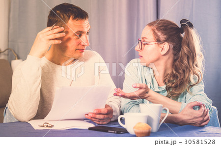 Couple struggling to pay bills Couple struggling to pay bills 30581528
