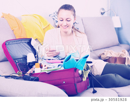 Smiling woman with laptop, paying by credit card Smiling woman with laptop, paying by credit card 30581928