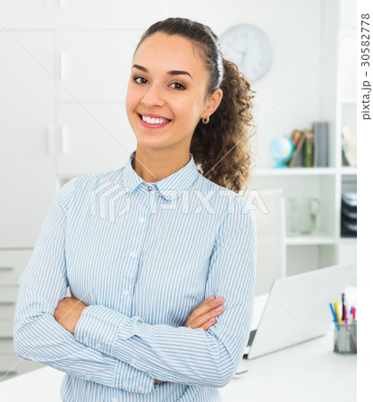 Successful glad woman working in modern office 30582778
