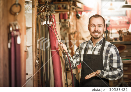 Worker demonstrating assortment in leather Worker demonstrating assortment in leather 30583422