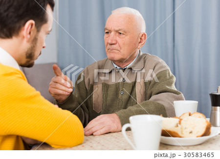 Aged father teaches his son 30583465