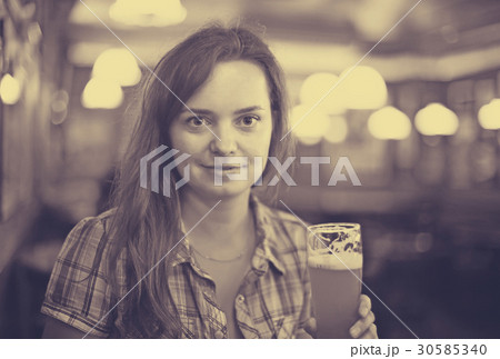 Girl with beer glass Girl with beer glass 30585340