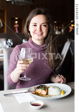 woman sitting in cafe 30585473