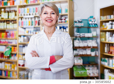 Female seller showing assortment of care products 30585602