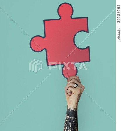 Human Hand Holding Jigsaw Puzzle 30588563