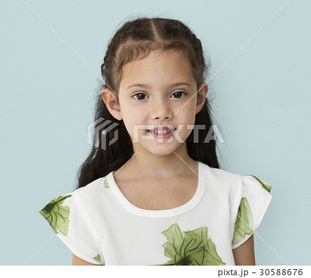 Young little girl with awkward smile expression portrait 30588676