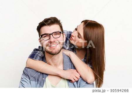 Happy casual couple posing to camera, isolated 30594266