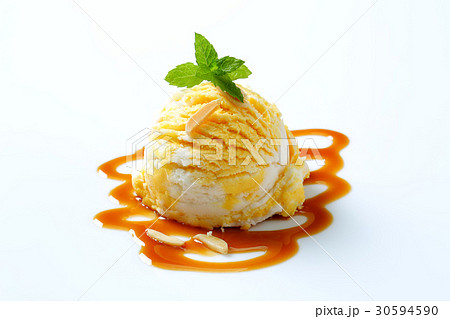 Ice cream with caramel sauce 30594590