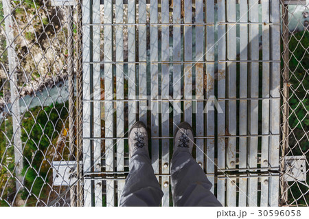 Suspension bridge in the mountains Suspension bridge in the mountains 30596058