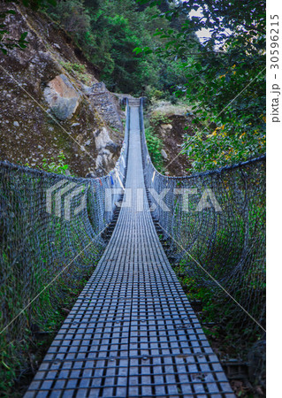 Suspension bridge in the mountains Suspension bridge in the mountains 30596215