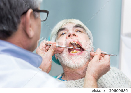 Old man at dentist office. 30600686
