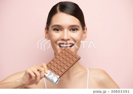 Enjoying chocolate 30603391