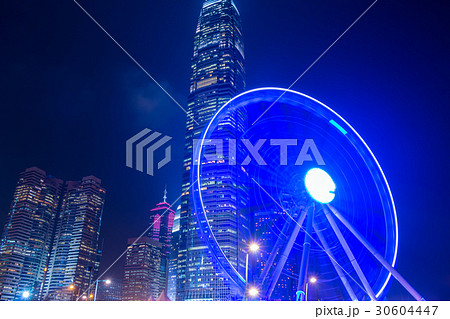 Large Ferris Wheel and Night Skyscrapers Large Ferris Wheel and Night Skyscrapers 30604447