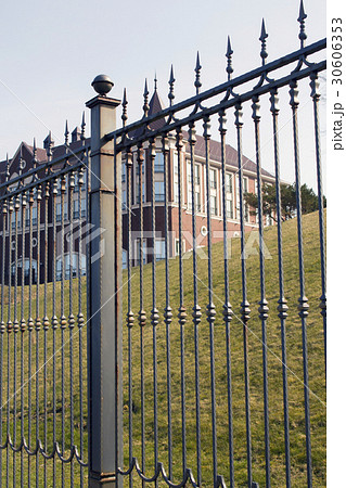 Metal fence and blue sky with clouds Metal fence and blue sky with clouds 30606353