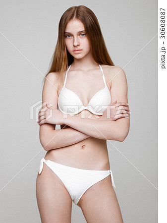 Young fit fashion model wearing white bikini Young fit fashion model wearing white bikini 30608087