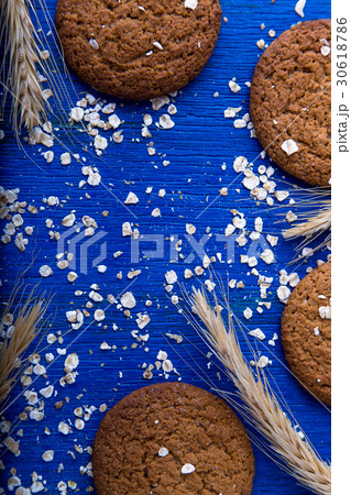Oatmeal cookies on blue backround. Top view. Oatmeal cookies on blue backround. Top view. 30618786