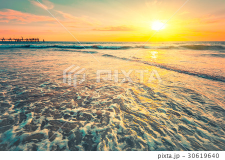 Waves at sunset on a warm evening Waves at sunset on a warm evening 30619640