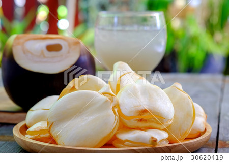 Toddy Palm,Palm juice with ice in wood tray. Toddy Palm,Palm juice with ice in wood tray. 30620419