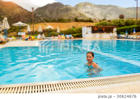 Girl in swimsuit swimming in pool, Bali, Crete 30624676