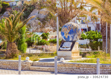 Monument with globe, book and handshake. Rethymno 30624730