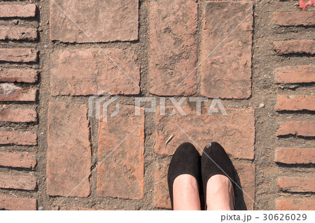 Brick Floor texture. Pavement patio woman's feet. 30626029