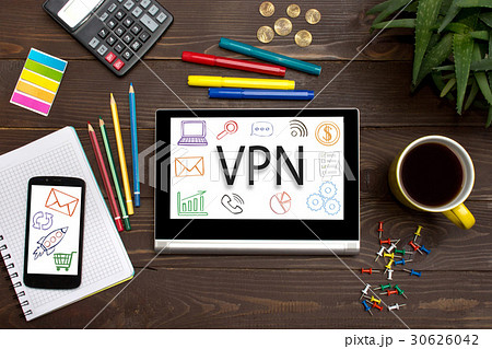 Tablet with web icon VPN on a wooden table Tablet with web icon VPN on a wooden table 30626042