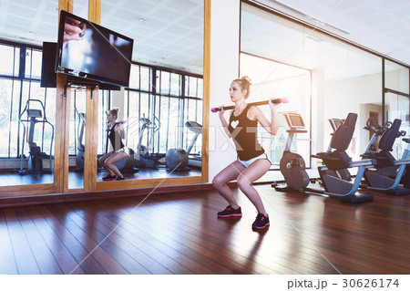 Pretty young woman training in the gym Pretty young woman training in the gym 30626174