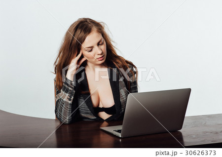 Sexy business woman or secretary with notebook Sexy business woman or secretary with notebook 30626373