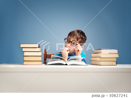 seven years old child reading a book seven years old child reading a book 30627241