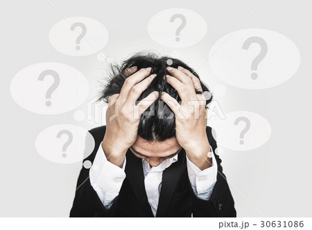 Businessman stressed out, with question marks 30631086