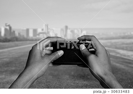 Man with camera in hands Man with camera in hands 30633483