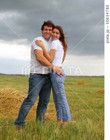 Couple in love in the summer field 30634780
