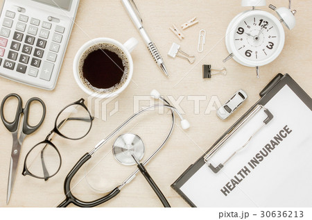 Top view health insurance form and eyeglasses . 30636213