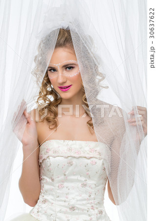 Bride with mask drawn on face Bride with mask drawn on face 30637622