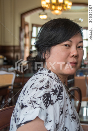 Asian women smile in coffee shop vintage style 30639207
