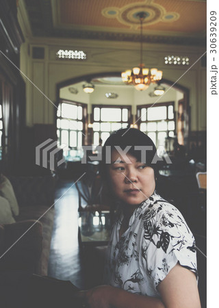 Asian women smile in coffee shop vintage style 30639209