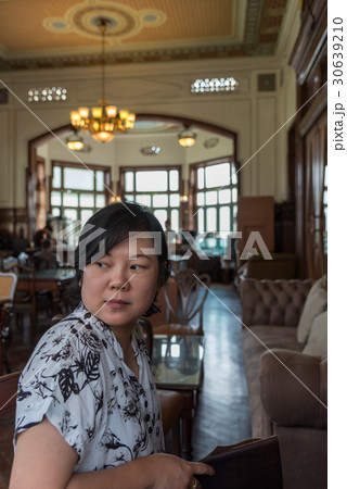 Asian women smile in coffee shop vintage style 30639210
