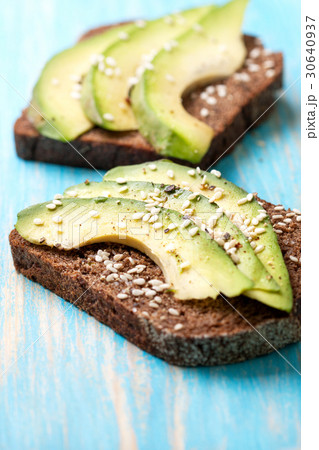 toast with slices of avocado and spices toast with slices of avocado and spices 30640937