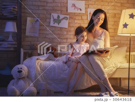 Family reading bedtime. Family reading bedtime. 30643618