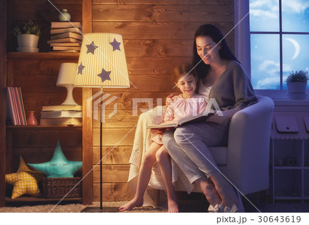 Family reading bedtime. 30643619