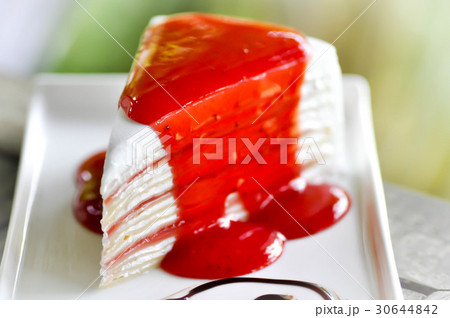 crepe cake with strawberry sauce topping 30644842