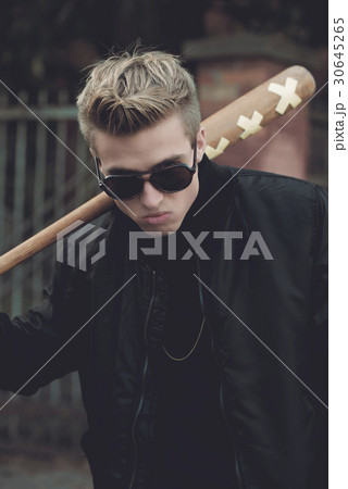 Young handsome blond haired hooligan with baseball Young handsome blond haired hooligan with baseball 30645265