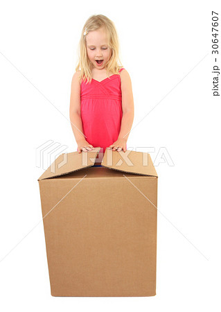 Young Girl Excited While Opening Gift Young Girl Excited While Opening Gift 30647607
