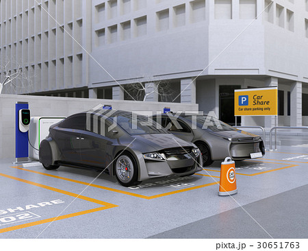 カーシェア専用駐車場に駐車している無人運転電気自動車。カーシェアリングのコンセプト カーシェア専用駐車場に駐車している無人運転電気自動車。カーシェアリングのコンセプト 30651763